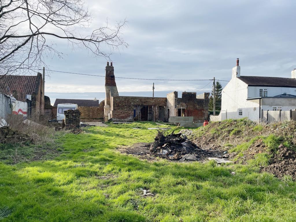 Lot: 58 - COTTAGE RENOVATION PROJECT WITH PLANNING IN VILLAGE LOCATION - Rear view from the bottom of the garden